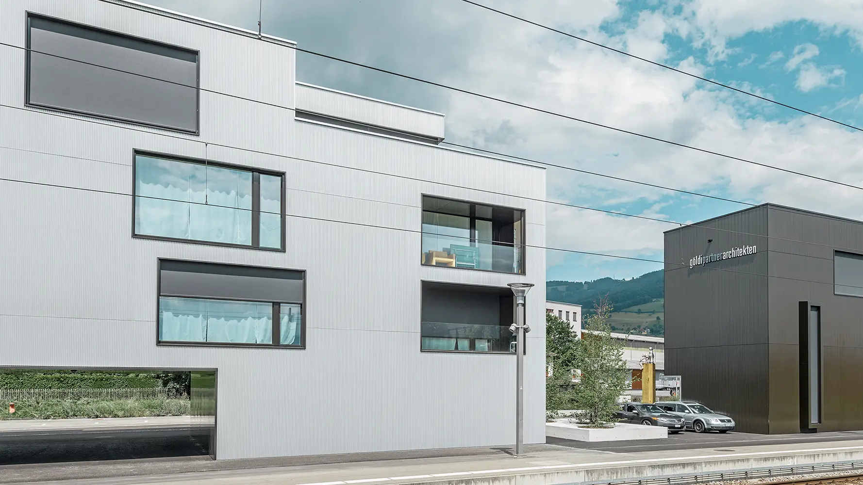 Apartment and office buildings with the PREFA serrated profile