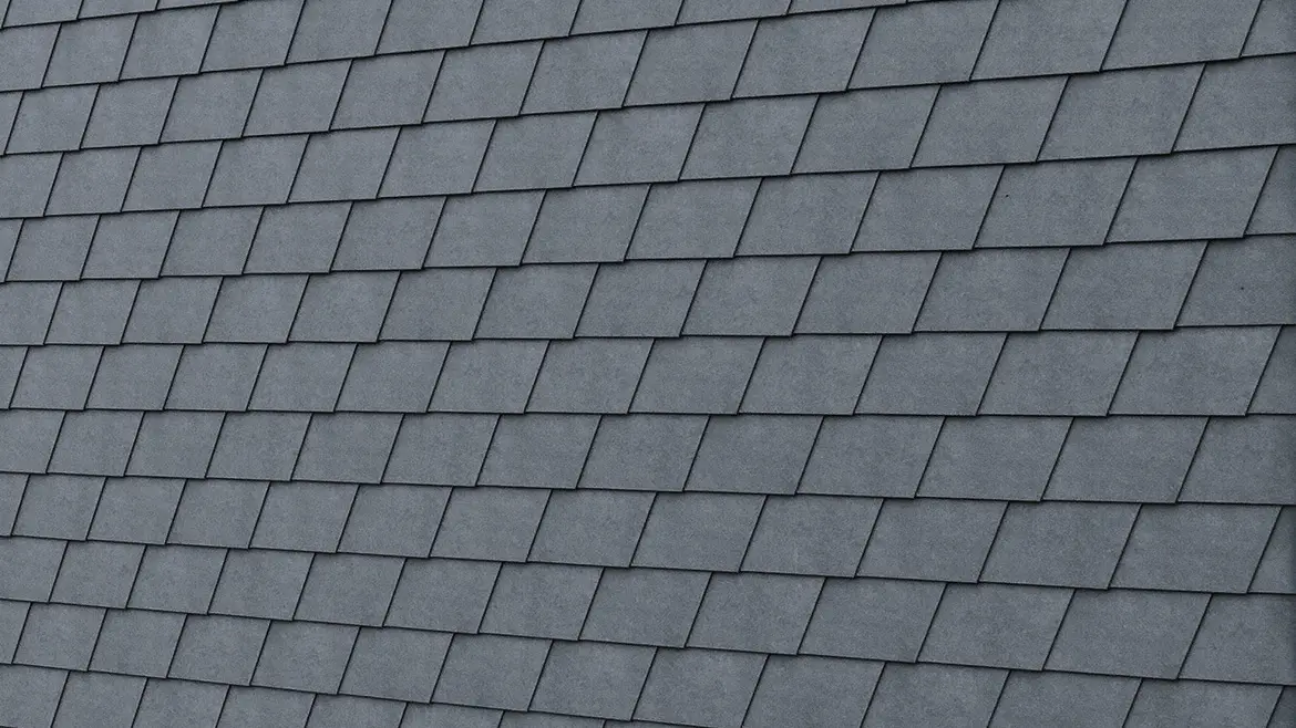 Detailed image of the PREFA façade shingle in P.10 stone grey