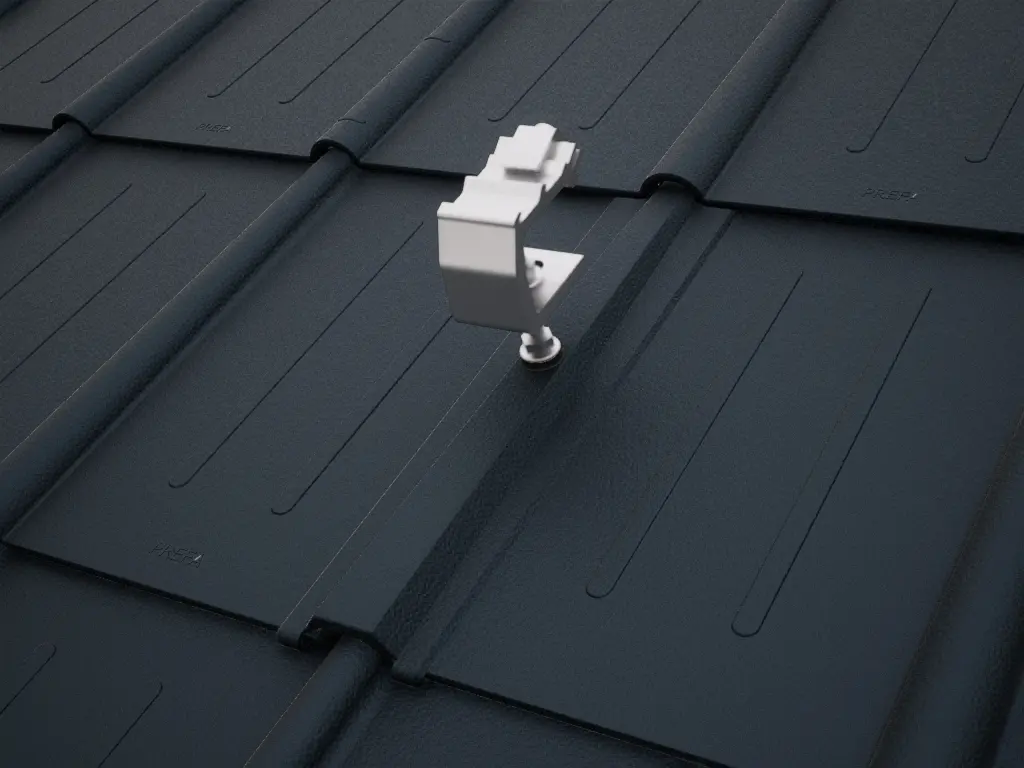 Detailed view of the PREVARIO Sunny Special solar bracket, mounted on a dark roof covered with PREFA roof tiles.
