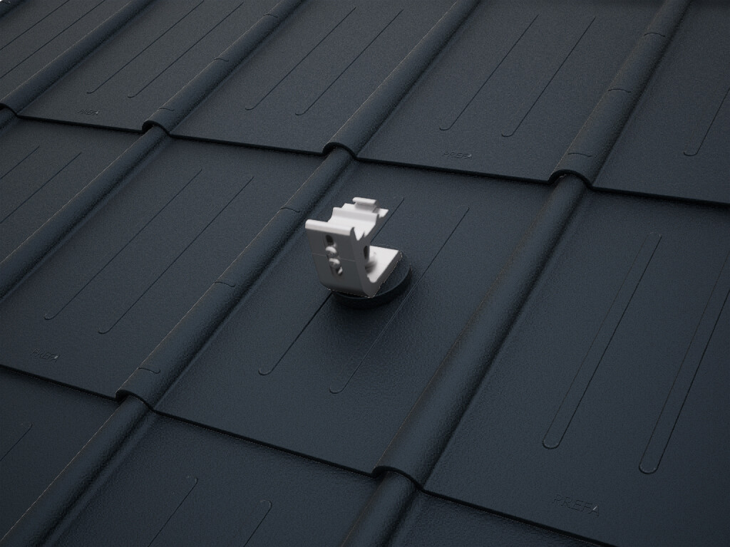 Detailed view of the PREVARIO 3.S solar bracket, mounted on a dark roof with PREFA roof tiles.